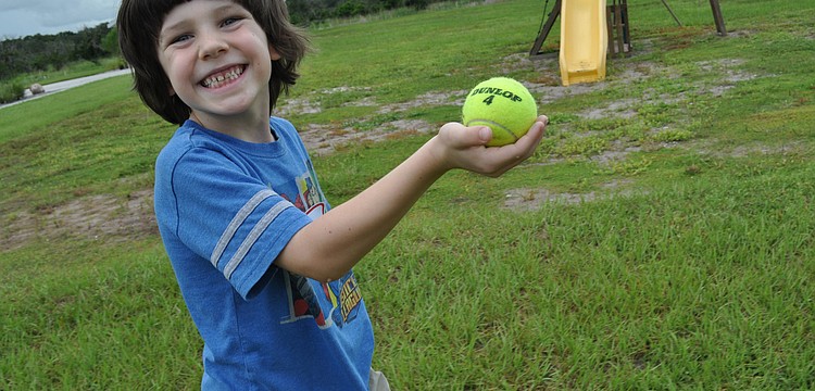 Six-year-old Sam Barr did not drop the ball he had to carry through part of the obstacle course relay event.