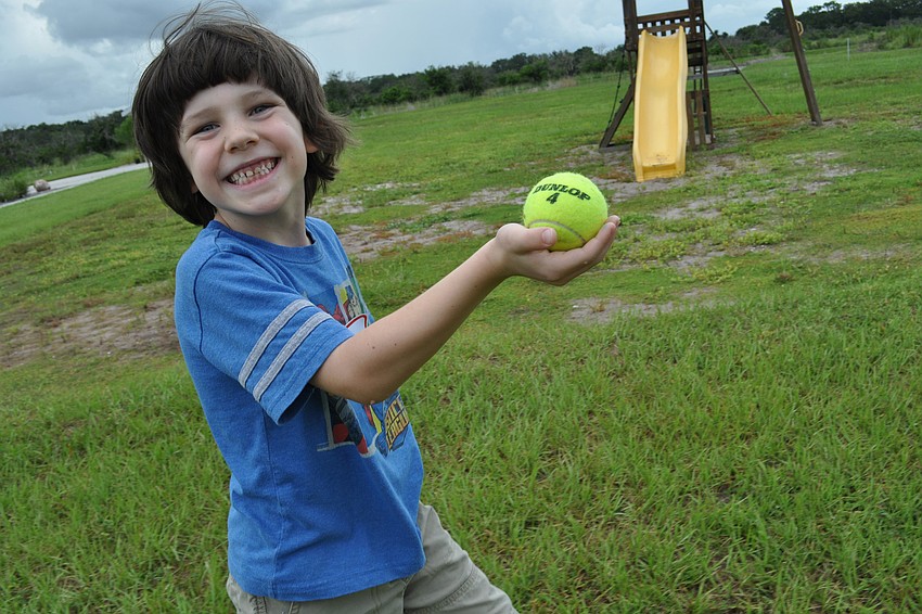 Six-year-old Sam Barr did not drop the ball he had to carry through part of the obstacle course relay event.