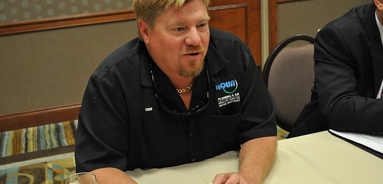 Todd Buchman, of Aqua Plumbing & Air, exchanged information with other participants.