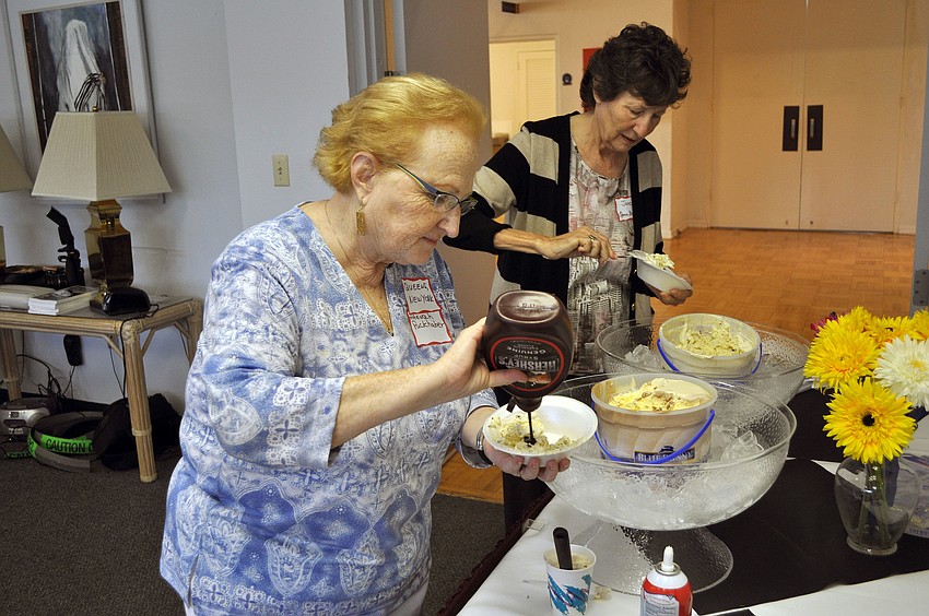 Hannah Puckerhaber and Jane Greenfield make themselves some sundaes, Sunday, Aug. 5, during Temple Beth Sholomâ€™s open house and ice cream social.