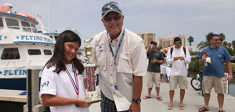 Jaimee Baker won a trophy for catching the most fish, a total of 21.