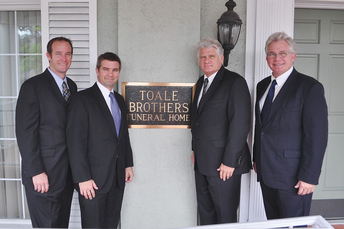 Brothers and third-generation owners Jeff and Jason Toale, with second generation owners Robert and Curt Toale at the Orange Avenue location.
