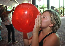 Bailey Brooks blows up an Observer beach ball