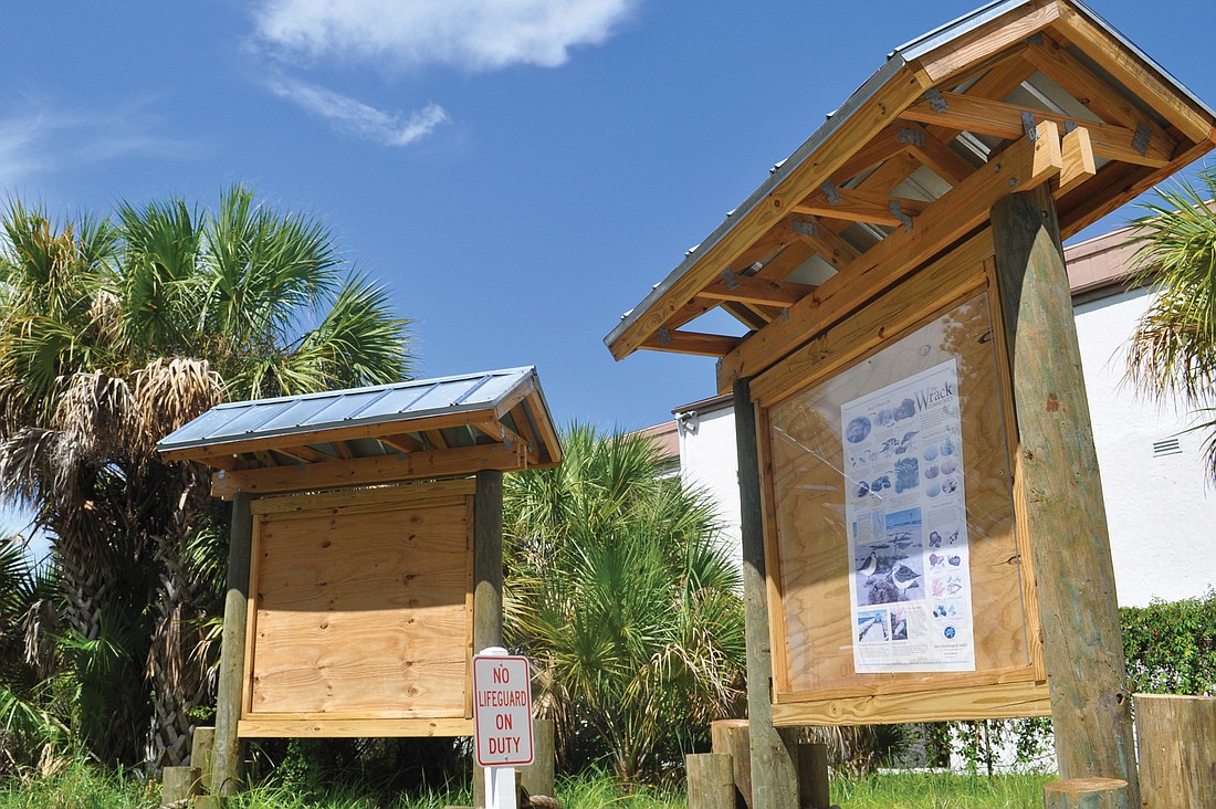 Sarasota County Parks and Recreation posts informative signs about wildlife and maps to Siesta Key landmarks on a kiosk at Beach Access 5.