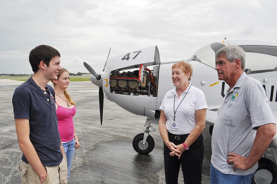 Brian Becker and his sister, Jen, talk with Young Eagle member Mary Lou McFate and pilot Dan Smith after their first Young Eagles flight.
