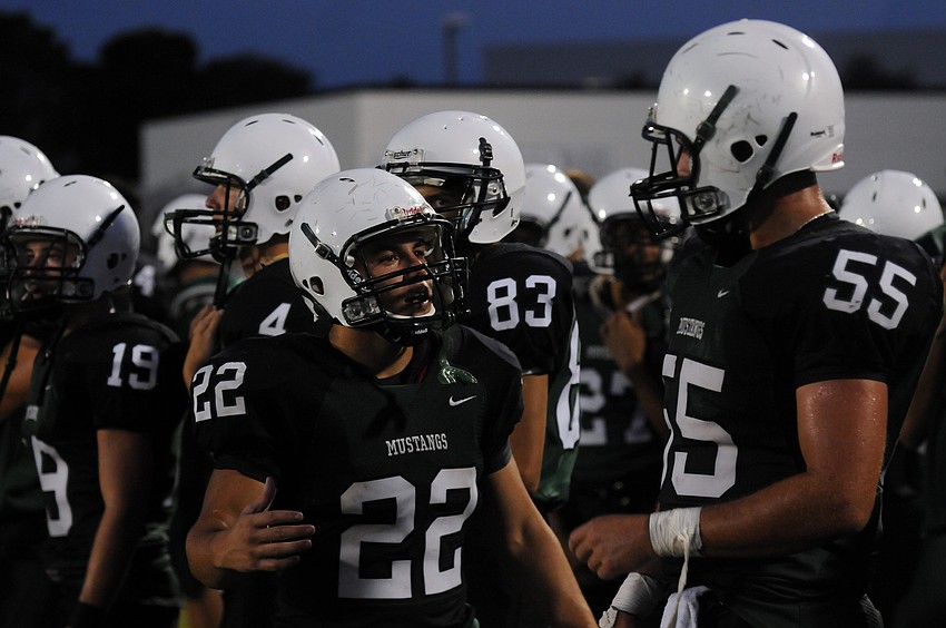 Lakewood Ranch senior cornerback Andre Christiano goes over the game plan with senior linebacker Luke Sears.