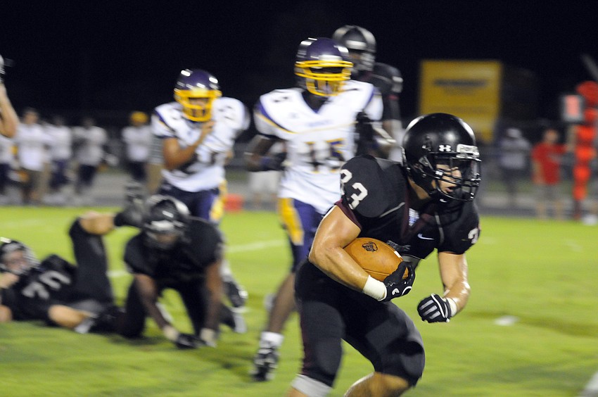 Junior fullback Krey Harwick fights for yardage in the second half of the Pirates preseason kickoff classic versus Booker.