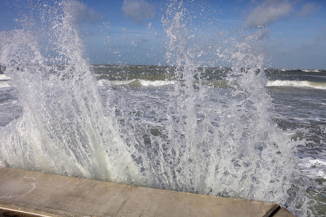 Waves crashed against the North Shore Road sea wall Tuesday, Aug 28.