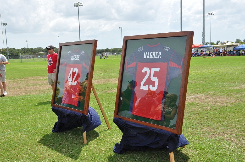 The families of Josh Rogers and Brett Wagner were presented with the boys' East Manatee Bulldogs jerseys.