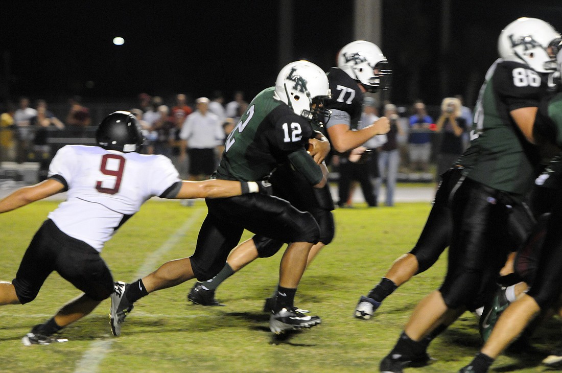 Lakewood Ranch running back Chris Pearcey carries the ball during the first half.