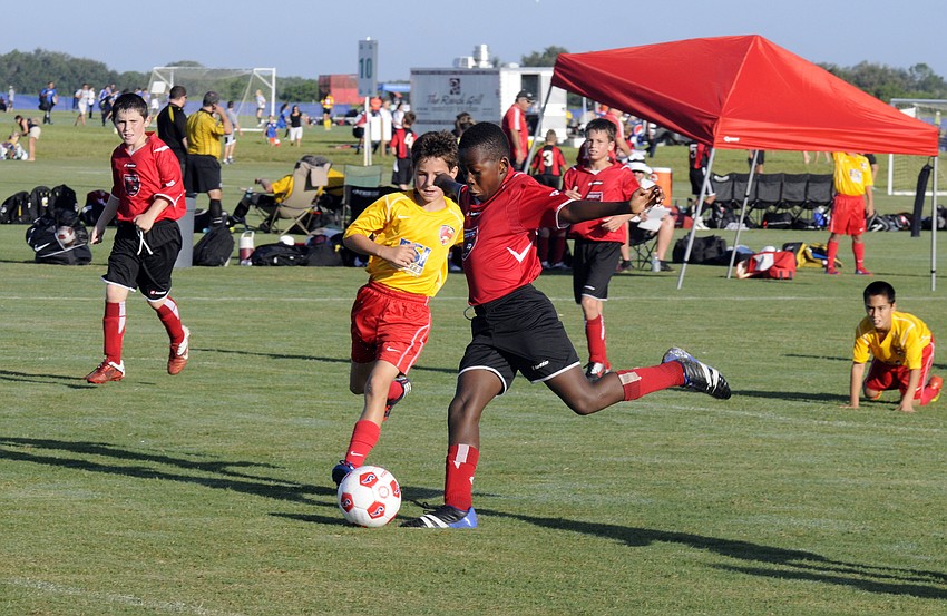 Center midfielder Malcolm Lewis attempts a shot for the Wesley Chapel Flames.