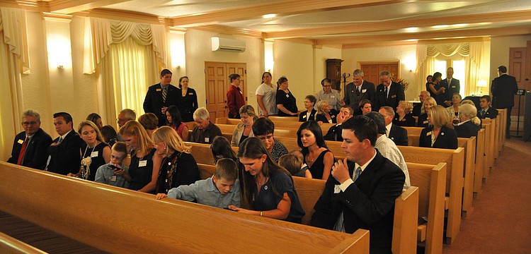 A crowd waits in the chapel for Mayor Atwell to deliver the proclamation.