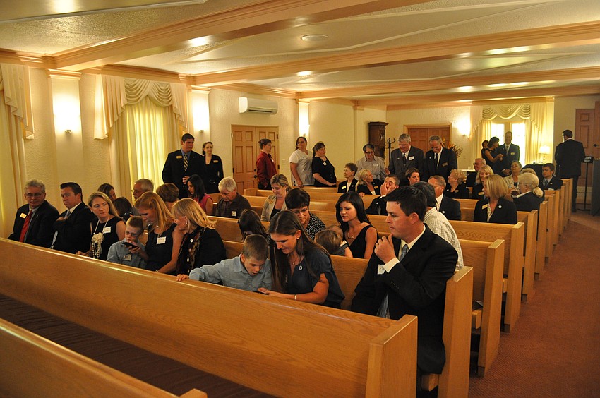 A crowd waits in the chapel for Mayor Atwell to deliver the proclamation.