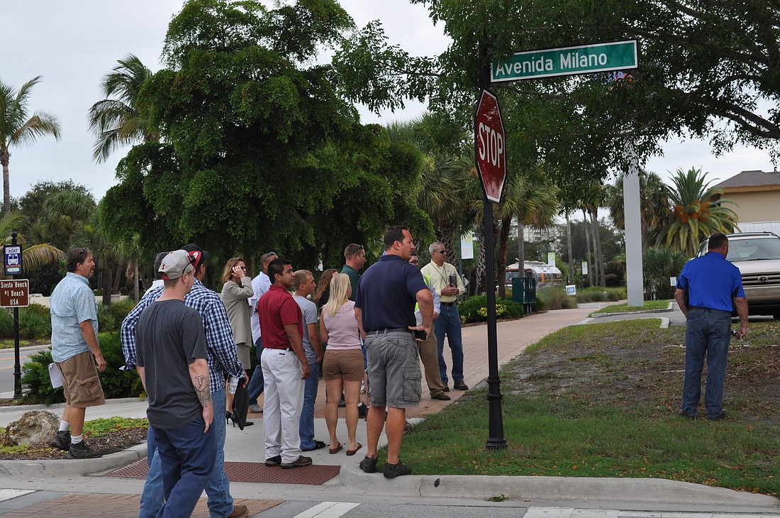 Representatives from several landscape and maintenance companies toured Siesta Key Village in June.