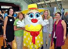 Teresa Tyrrell, Vicki Vega, Heather Kasten and Robin Parsons pose with the Broken Egg's mascot, Eggwina.
