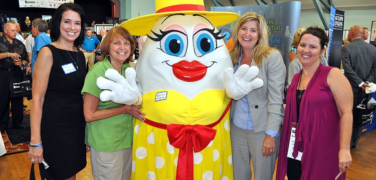 Teresa Tyrrell, Vicki Vega, Heather Kasten and Robin Parsons pose with the Broken Egg's mascot, Eggwina.