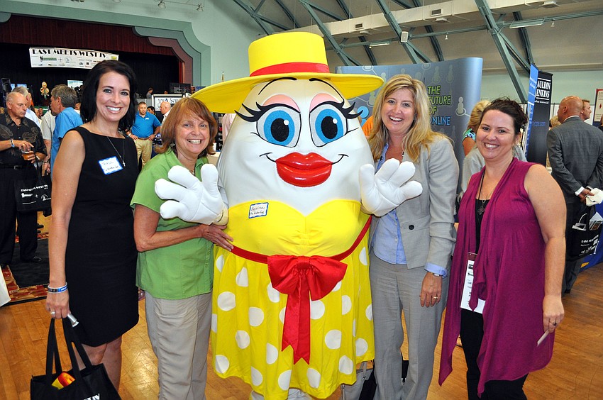 Teresa Tyrrell, Vicki Vega, Heather Kasten and Robin Parsons pose with the Broken Egg's mascot, Eggwina.