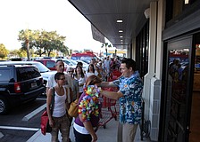 As customers made their way into the store they were given a lei and a shopping cart.