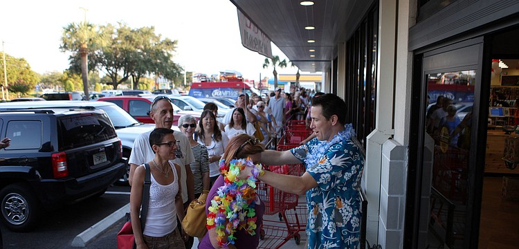 As customers made their way into the store they were given a lei and a shopping cart.