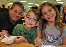 Dillon Forbes, center, enjoyed ice cream with his dad, Lee, and friend Gianna Caso, right.