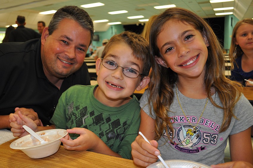 Dillon Forbes, center, enjoyed ice cream with his dad, Lee, and friend Gianna Caso, right.