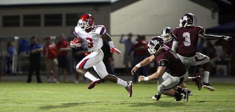 Ja Juan Pollock. No. 3, bolts down the field as Sam Johnson, No. 44, tries to catch him Friday, Sept. 7.