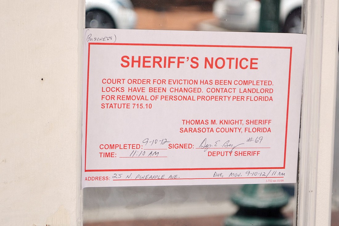 An eviction notice was taped to the door of the Golden Apple Dinner Theatre Monday, Sept. 10. Photo by Roger Drouin.