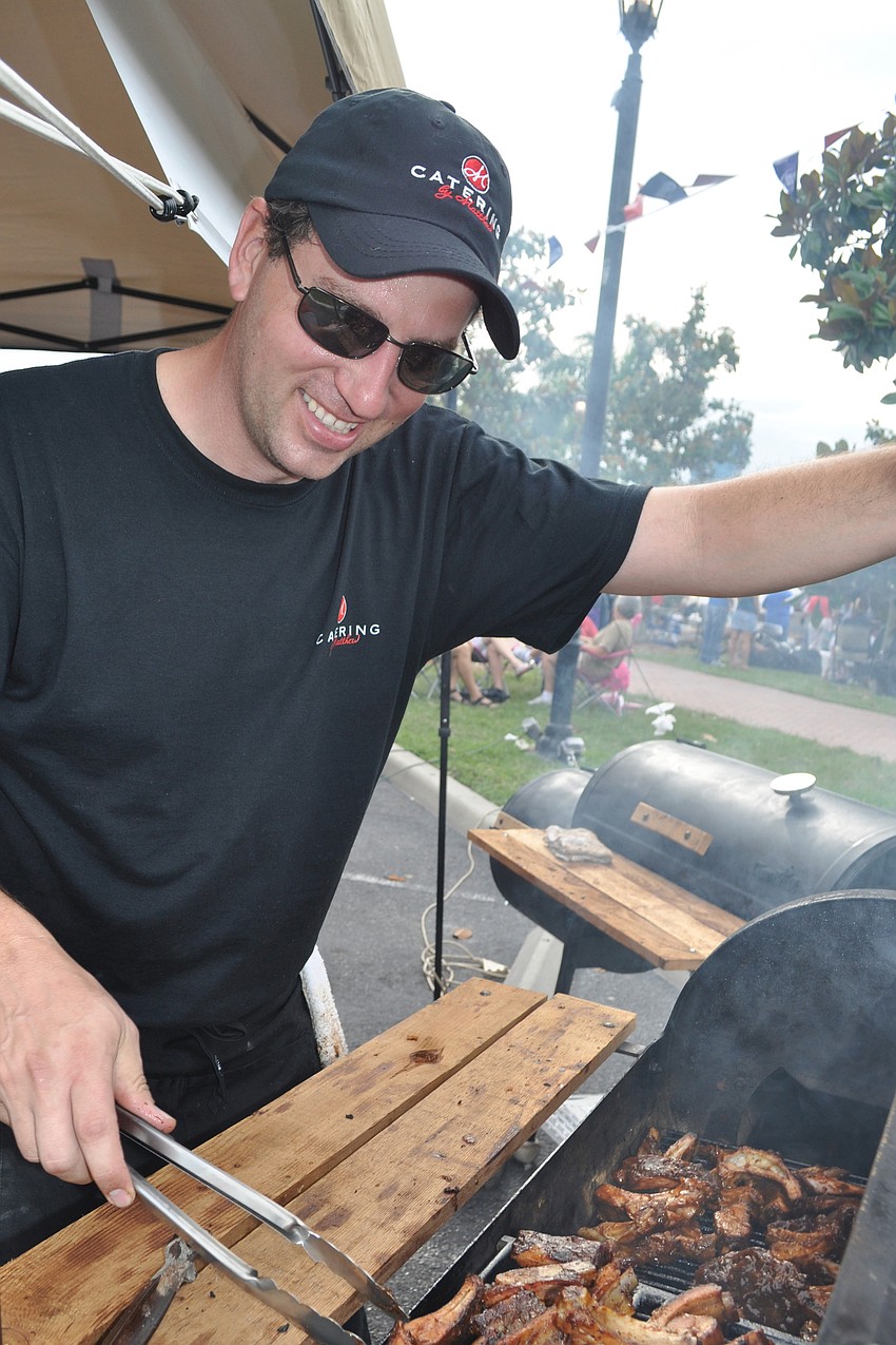 Matt Kaskey, of Catering by Matthew, checked on his baby back ribs.