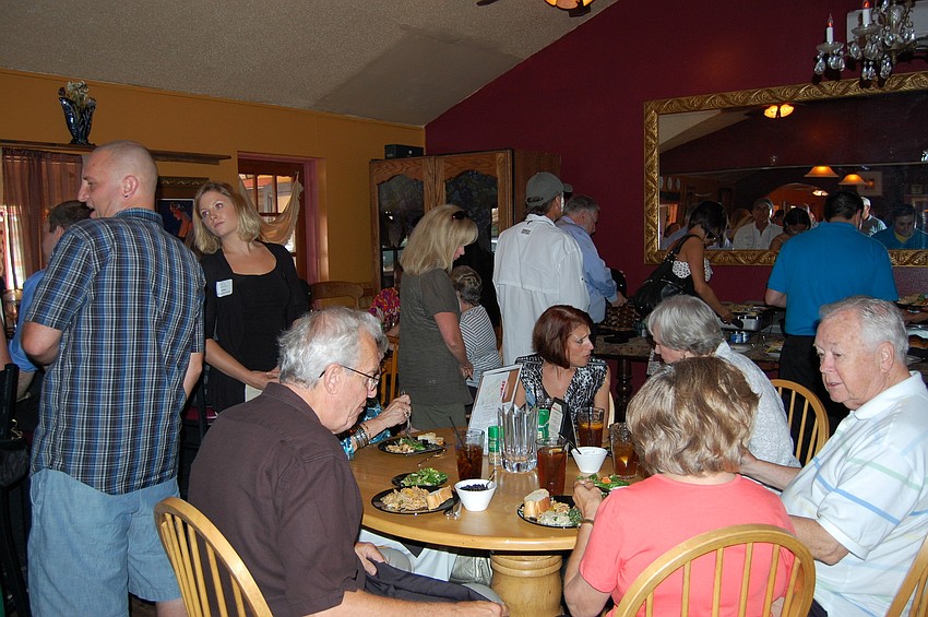 Siesta Chamber members enjoyed a family style buffet at the newly renovated BlasÃ© Cafe.