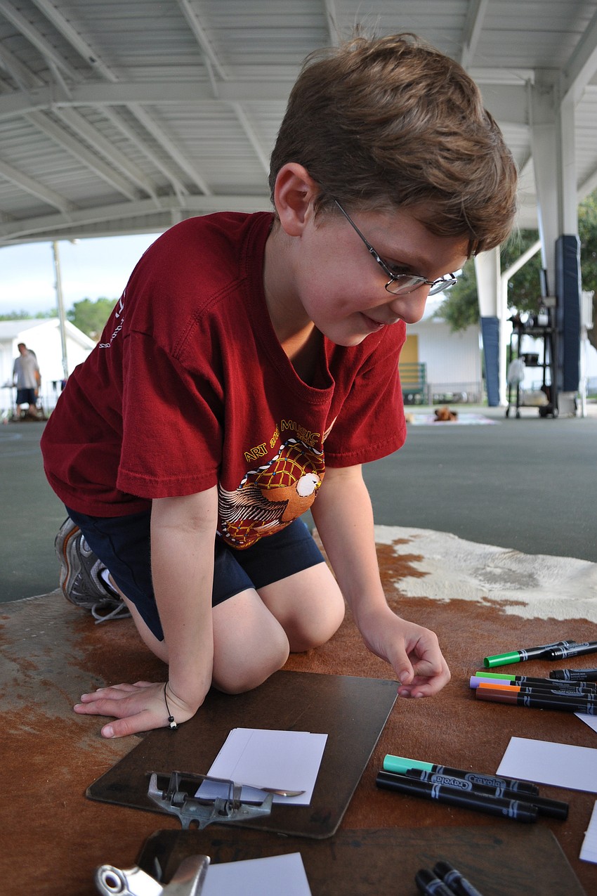 Gabriel McDerment picks out lettering for his 