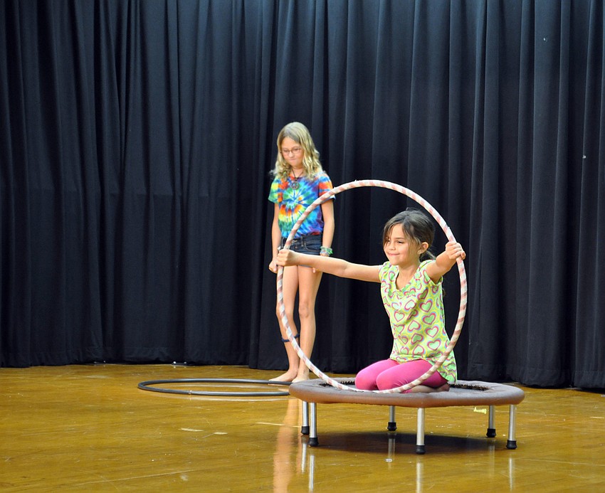 Autumn Snyder and Bryce Bennett hula-hoop to â€œWalking on Sunshine.â€