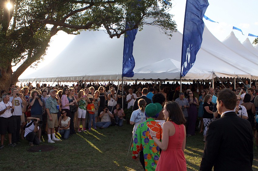 The class of 2012 makes their way into the tent for the commencement ceremony.