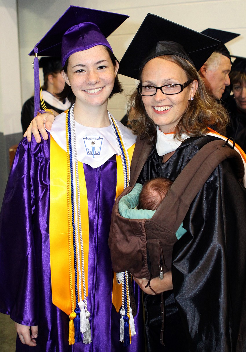 Sara Stolpe, No. 1 in the class, poses with Rebecca King and her 4-week-old daughter, Anna.