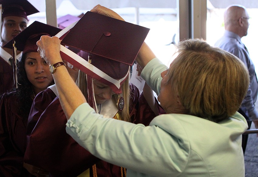 Hannah Wittmer has her medal put on her by Judy Meksraitis, Saturday, June 2.