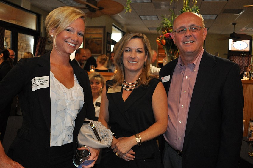 Erin McWhorter, of Berlin Patten Law Firm, with Cherri Kessler, of M&I, and Larry Richards, of KW Commercial