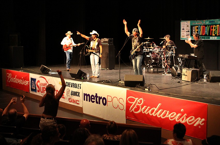 Hundreds of people enjoyed singing and dancing to the tunes played by Adrian Ray, Friday, July 13, at Friday Fest.