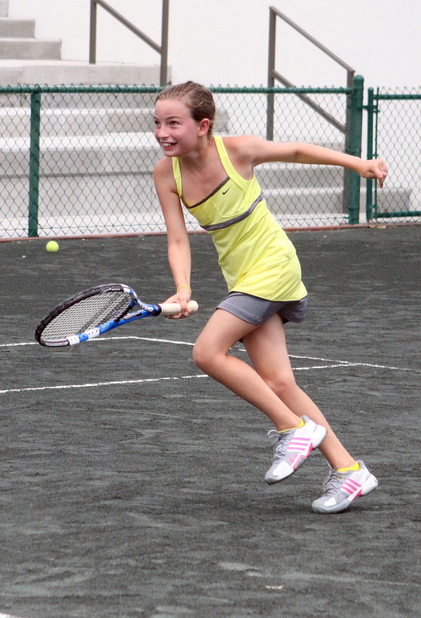 Brenna Keough, 9, runs across the court during a game of 