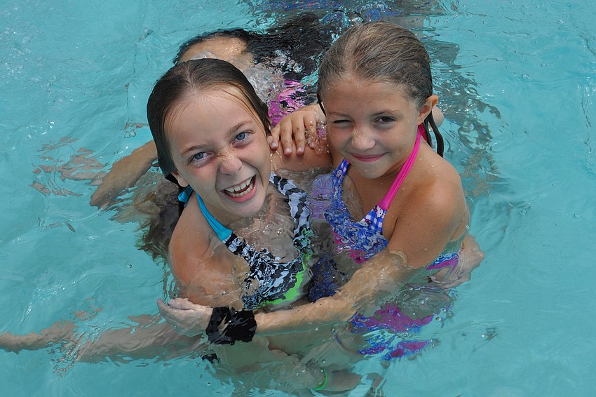 Brianna Taylor and Kylie Kuchera, both 8, met at camp.