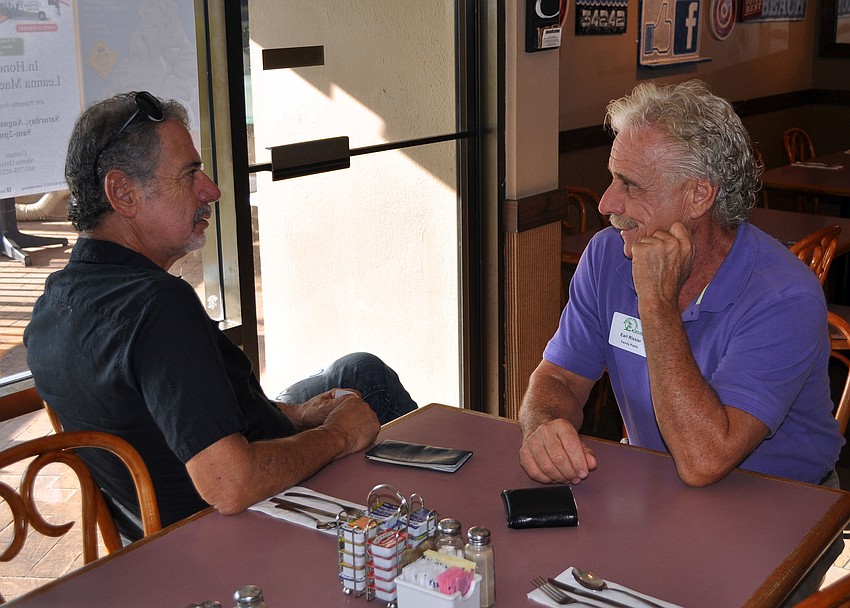 David Rubinfeld and Earl Rissler pulled up some chairs and caught up with one another during the SKCC After Hours event, Thursday, Aug. 16, at the Village CafÃ©.