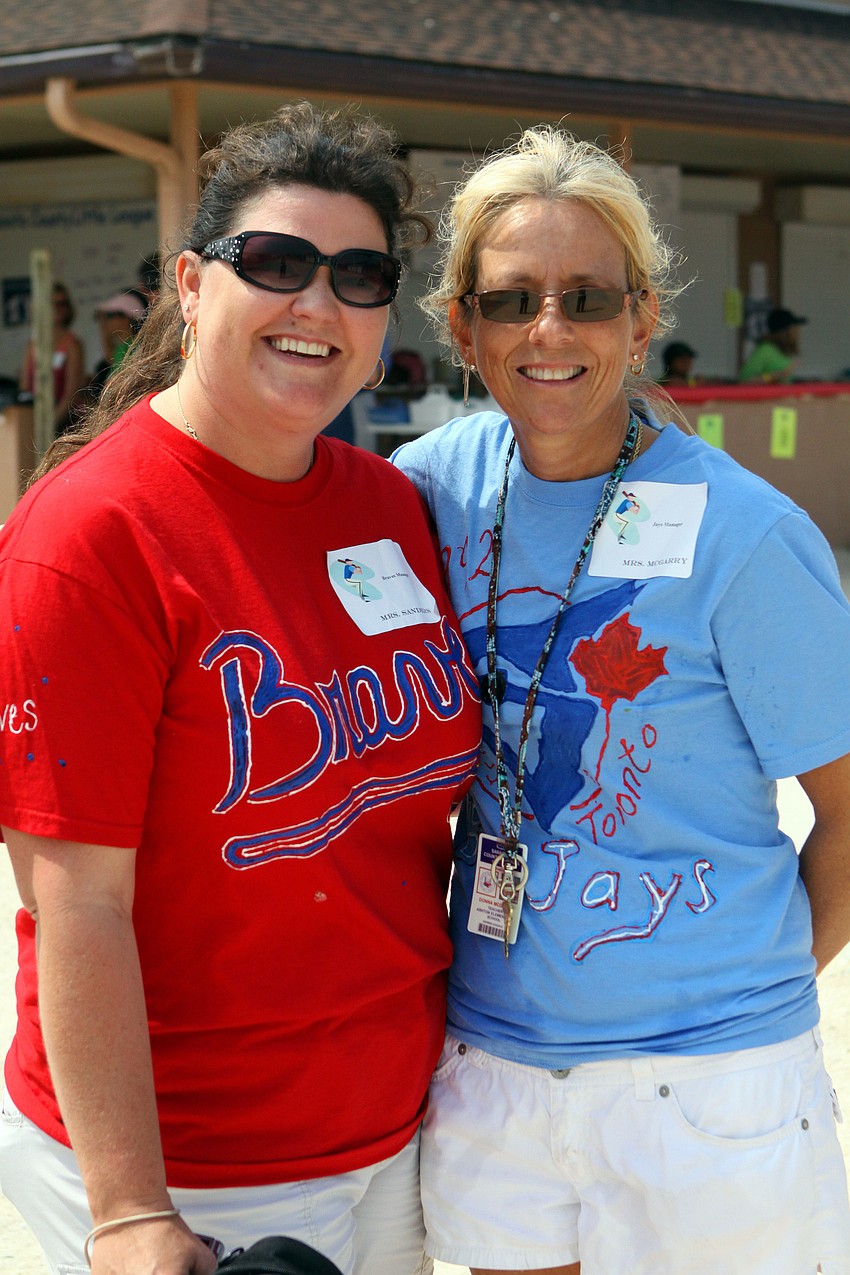 Fifth grade teachers Stacy Sanders and Donna McGarry pose together inbetween innings Friday, April 29 during the Ashton Elementary fifth grade World Series day at Twin Lakes.
