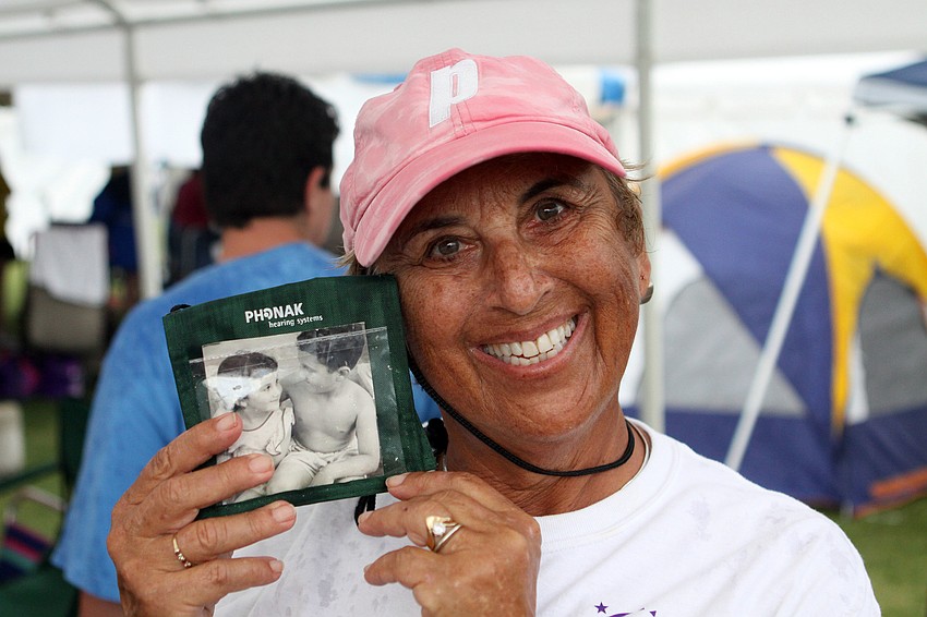 Susan Mitloff walked with a photo of herself with her brother, Jared Jossem, who passed away from cancer 9-years-ago.