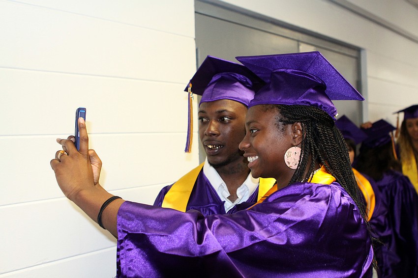Jeremy Taylor and Ebony Bass pose together to take a photo on Bassâ€™ phone, Saturday, June 2.