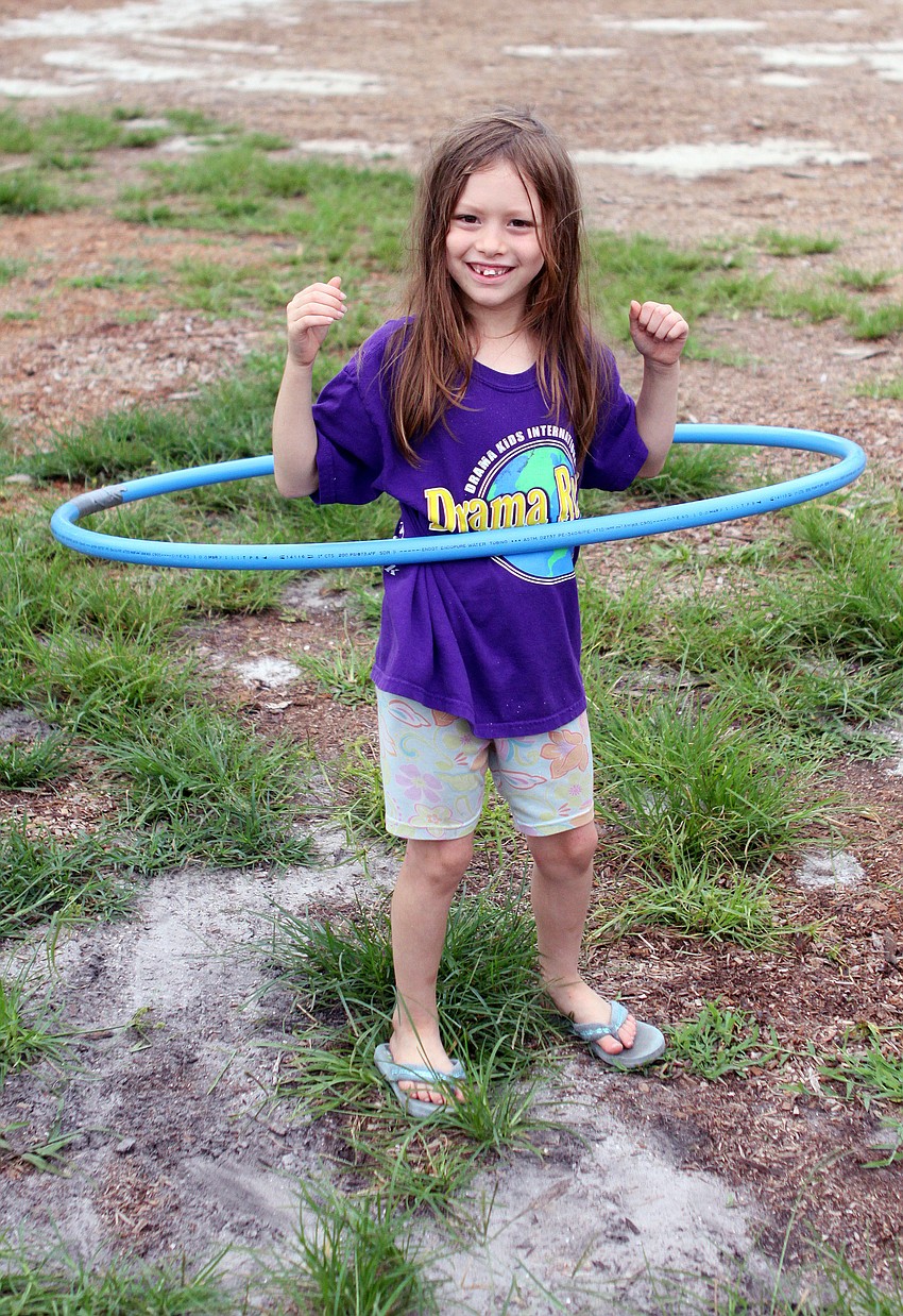 Ursula Kushner, 7, had fun hula-hooping, Wednesday, June 6, at Childrenâ€™s Day at the Phillippi Farmhouse Market.