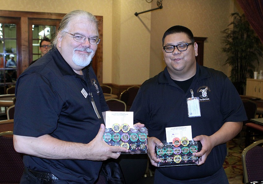 Lonnie Hutchins and Ray Oritz get ready to deal the cards in the poker tournament.
