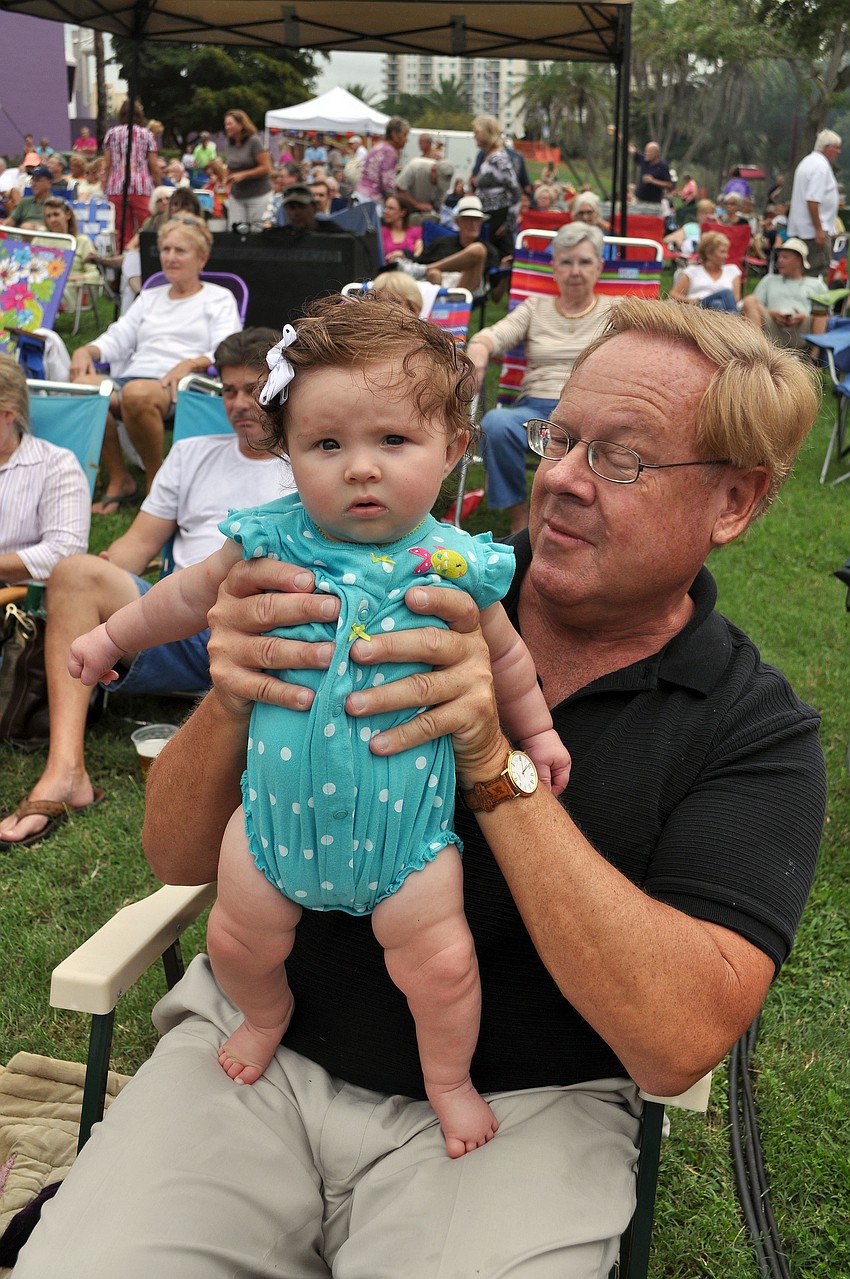 Bob Peiser helps Reagan Peiser, 4 mos., rock out to Yesterdayze, Friday, June 8, at Friday Fest.