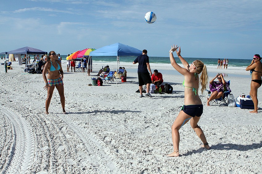 Paola Ortiz and Jenna Schneider practice prior to playing in the Dig the Beach Tournament, Saturday, June 9, on Siesta Key Beach.