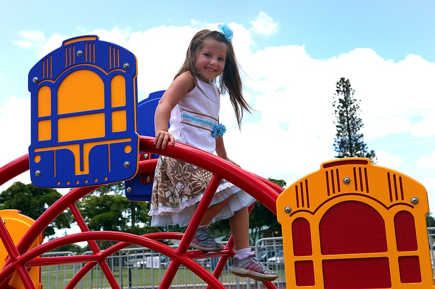 Mackenzie Heise, 6, has fun on the â€˜ferris wheelâ€™.