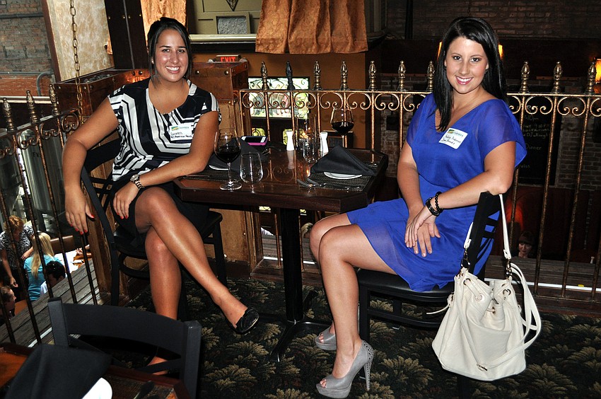 Lauren Pulsifer and Kelsey Anderson sit upstairs at Darwinâ€™s during YPGâ€™s monthly after hours.