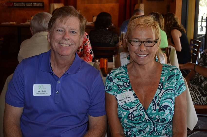 Mark Smith with Smith Construction and Rebecca Ronan with Welcome Guide Map
