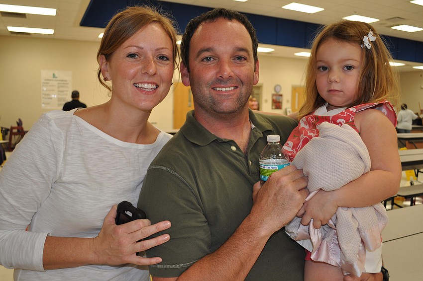 Deanna and Trevor Scott, with their daughter, Lola, dropped off their oldest child, 5-year-old Isabella, to school for the first time.